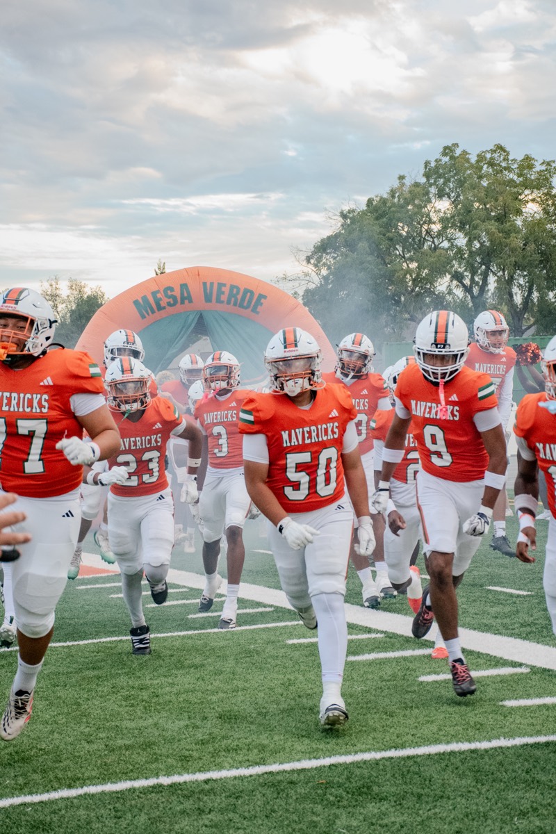 Varsity burst vs St. Vincent. #50, #9, #23 out of the tunnel.